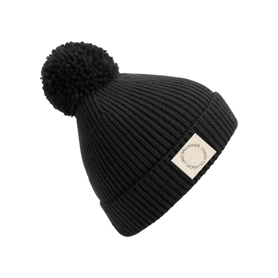 Black hat with white bobble 2025